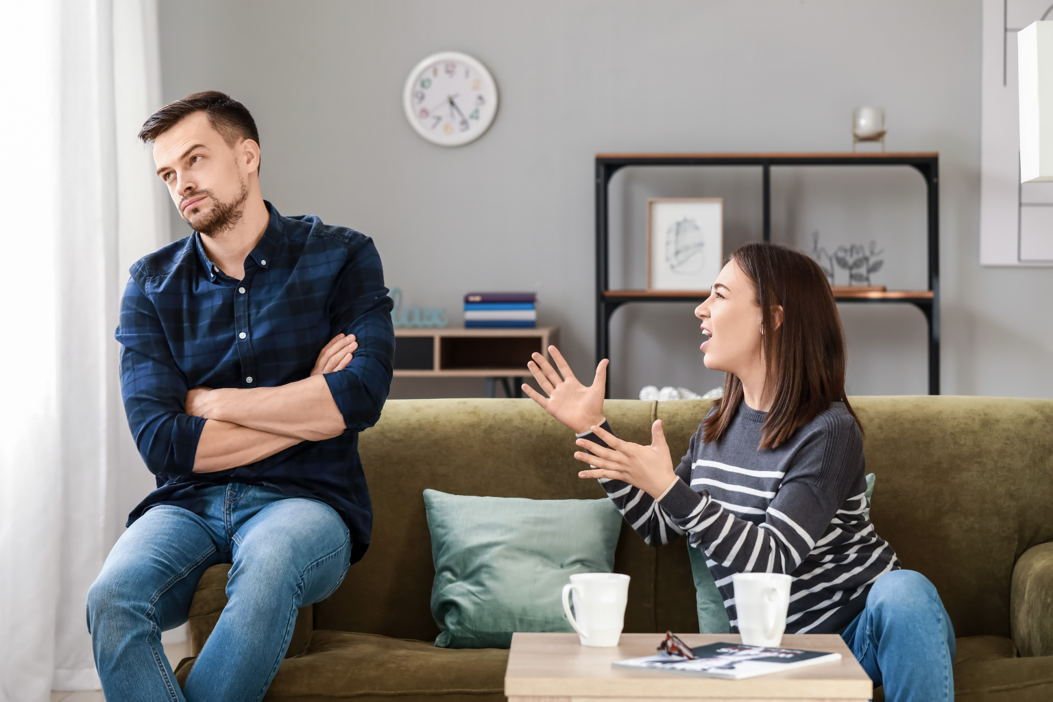 Young couple quarreling at home